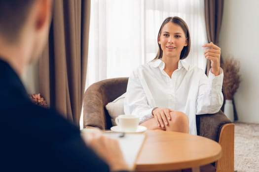 Psychological consultation gaining improvement on mental problem, happy young female patient doing therapy session while psychiatrist making diagnostic on mental illness. Unveiling