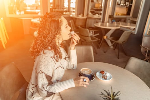 Woman cafe coffee breakfast. Portrait of an adult beautiful woman in an elegant suit in a cafe.