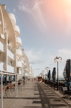 coastal area with apartment buildings of residential areas, modern hotel and restaurant complex on water and sandy beaches