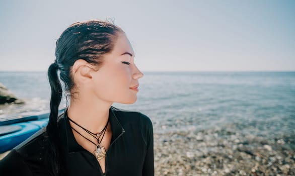 Woman travel sea. Young Happy woman posing on a beach near the sea on background of volcanic rocks, like in Iceland, sharing travel adventure journey