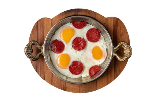 fried eggs with turkish sausage with bread and tea on dark white background