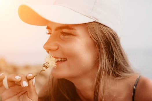 Woman travel sea. Happy tourist taking picture outdoors for memories. Woman traveler looks at the edge of the cliff on the sea bay of mountains, sharing travel adventure journey.