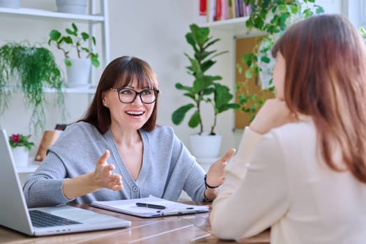 Young woman university college student at meeting with female professional mental therapist, social worker, counselor, behavior. Psychology therapy help counseling treatment support, mental health