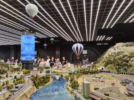 Saint-Petersburg, Russia - August 03, 2023: grand project Russia. Layout of city, country, street, landscape with small toy people, houses, roads, cars, nature and visitors tourists in the museum