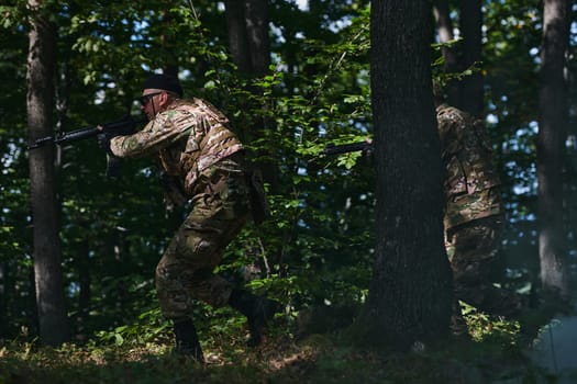 A specialized military antiterrorist unit conducts a covert operation in dense, hazardous woodland, demonstrating precision, discipline, and strategic readiness.