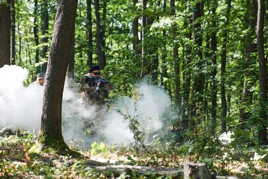 A specialized military antiterrorist unit conducts a covert operation in dense, hazardous woodland, demonstrating precision, discipline, and strategic readiness.