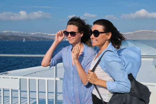Family travel luxury cruise vacation, mother and teenage daughter enjoy sea trip on deck of liner on sunny summer day