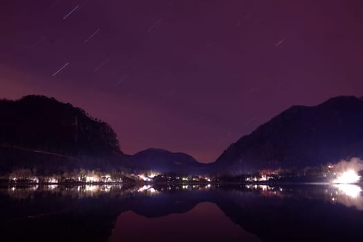 long exposure night with startrail is a trail of starlight that appears across the sky as a meandering or circular line. This is a stunning visual effect which reveals the Earth's rotational motion