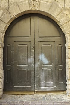 Old vintage wooden facade decorative brown door.
