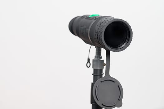 Monocular on a tripod isolated on a white background, monocular for military action.