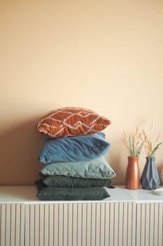 stack of colorful pillows on table ,