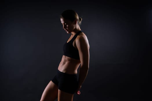 Close up of woman back with muscles after workout. Female bodybuilder with perfect biceps