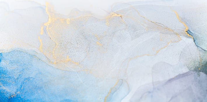 Abstract art with blue and gold background, beautiful smudges and stains made with alcohol ink. Abstract painting, background for wallpapers, posters, cards, invitations, websites.