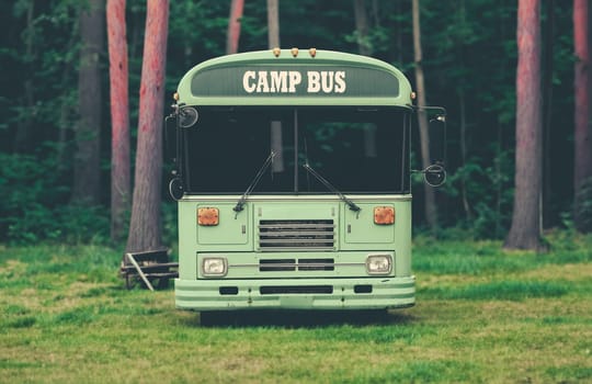 A Bus For Taking Kids To Summer Camp In A Beautiful Forest