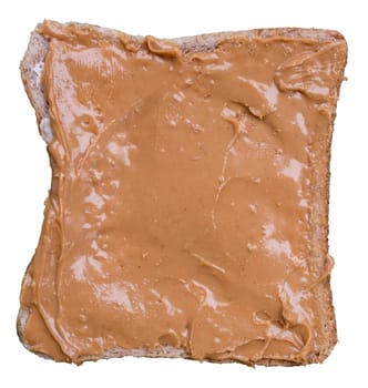 Organic Peanut Butter Spread Over A Piece Of Wholemeal Bread, Isolated On A White Background