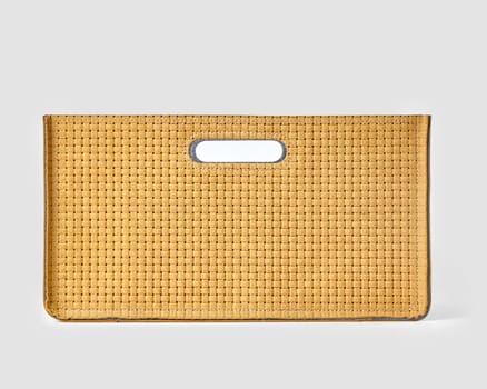 Front view of tan woven suede storage box with sturdy build and convenient slotted handles, ideal for stylishly organizing spaces. Modern craft accessory for interior design