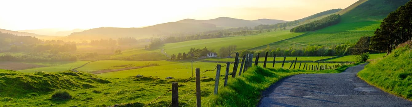 Panorama Of A Single-Track Road Snaking Through The Beautiful Scottish Countryside At Sunset