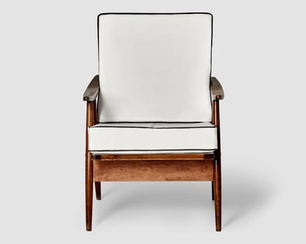 Elegant wood-framed chair with white leather padding, merging classic design with touch of modern comfort. Handcraft piece of furniture for stylish interior