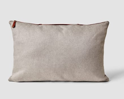 Natural textured grey fabric pillow featuring contrasting leather zipper, embodying modern and rustic home aesthetic. Handcrafted accessory for interior design
