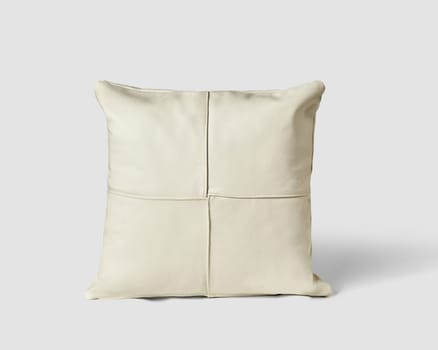 Minimalist soft padded sofa cushion made of white leather patches decorated with neat stitching. Stylish item of interior design