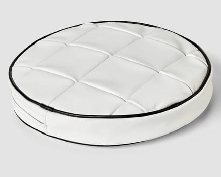 Stylish round cushion featuring white leather patchwork top with contrasting black trim, perfect for minimalist interior decor