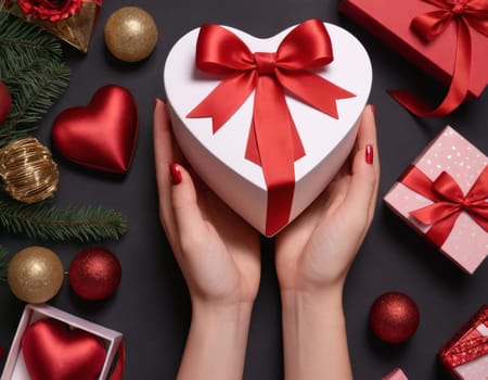 A pair of elegant hands gracefully hold a heart-shaped gift box adorned with a delicate red ribbon. The image evokes a sense of love and affection and is perfect for occasions like Valentine s Day or anniversaries.