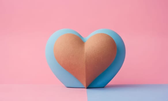 A textured heart shape stands prominently against a dual-tone background. The soft texture of the heart contrasts beautifully with the smooth blue and pink backdrop. Ideal for themes of love and romance.