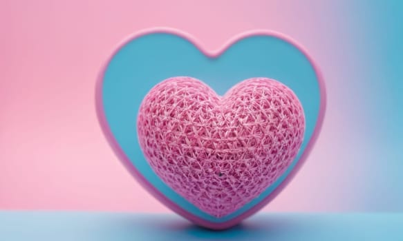 A textured heart shape stands prominently against a dual-tone background. The soft texture of the heart contrasts beautifully with the smooth blue and pink backdrop. Ideal for themes of love and romance.