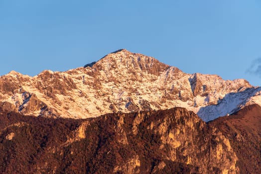 Snowcapped mount Grignetta at lake Como, Italy