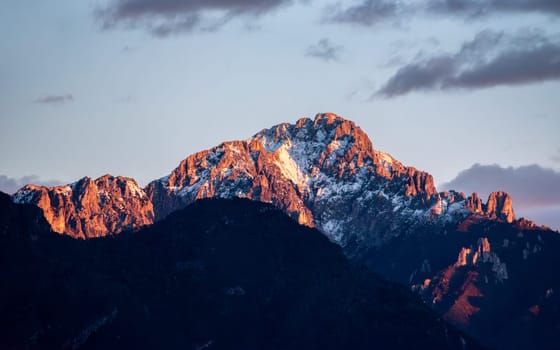 Sunset at snowcapped mount Grigna at lake Como, Italy