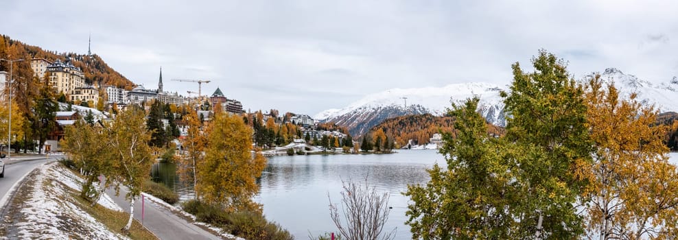 St. Moritz and lake in autumn, surrounded by snowcapped mountains, Switzerland