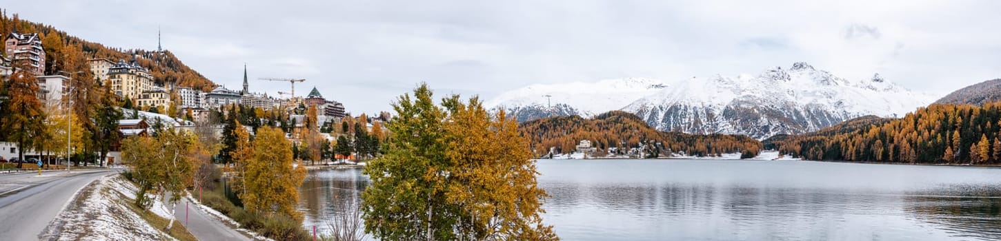 St. Moritz and lake in autumn, surrounded by snowcapped mountains, Switzerland