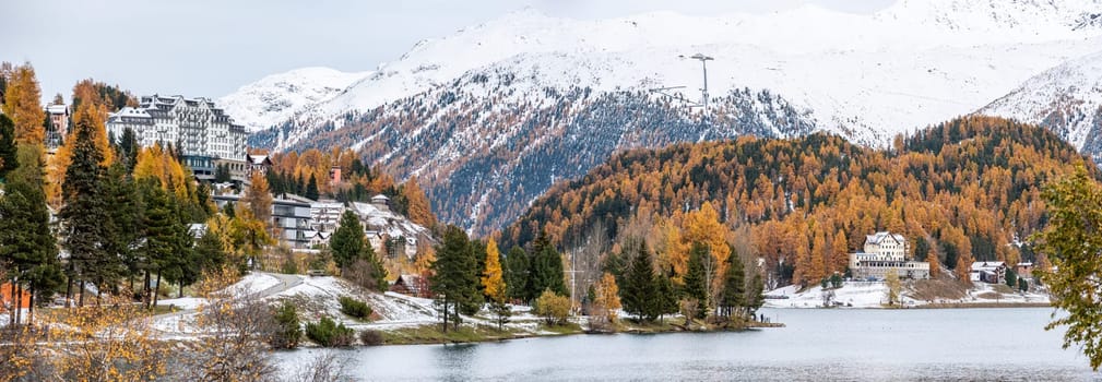 St. Moritz and lake in autumn, surrounded by snowcapped mountains, Switzerland