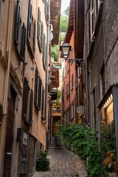 BELLAGIO, ITALY - OCTOBER 02,2023 - A narrow alley at a hill in the center of Bellagio, Italy