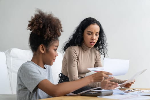 Stressed African American women has financial problems with credit card debt to pay crucial show concept of bad personal money and mortgage pay management crisis.