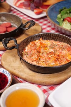 Turkish Menemen omelet in a frying pan.