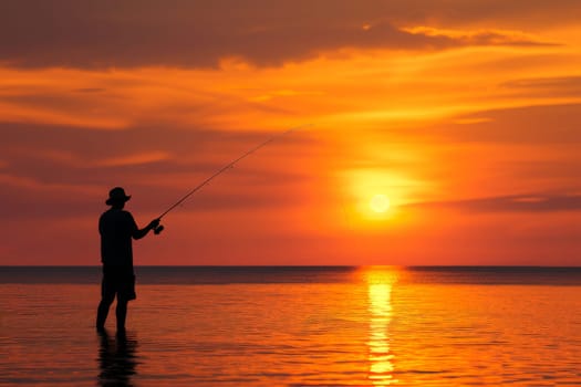 Sport fishing man with sunset, silhouette Fisherman.