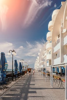 coastal area with apartment buildings of residential areas, modern hotel and restaurant complex on water and sandy beaches