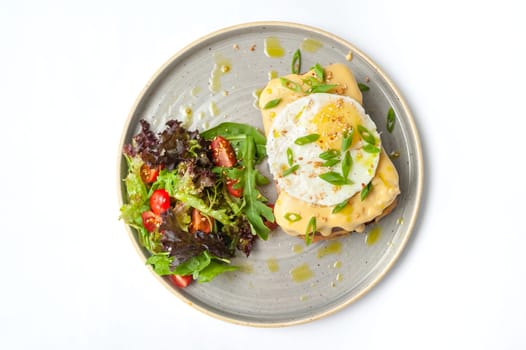 An exquisite set of breakfast dishes: croissants, toast, scrambled eggs, salad, bruschetta on a white background