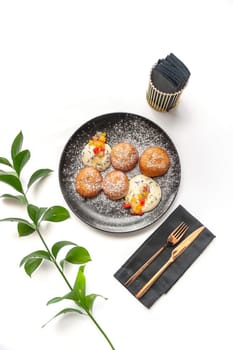 Pancakes with fruit, vanilla mousse and powdered sugar