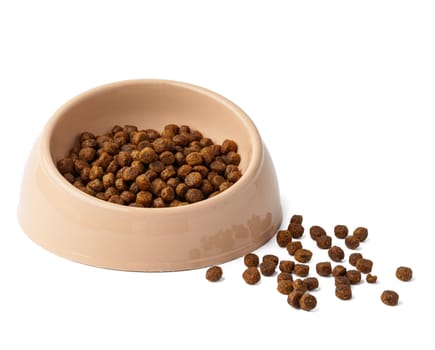 Bowl with dry pet food isolated on white background close up