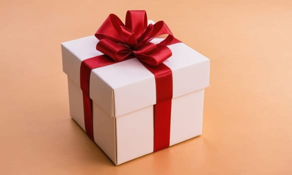 A beautifully wrapped gift adorned with a vibrant red bow sits elegantly against a backdrop of more presents and festive decorations. The scene captures the spirit of giving and the joy of the holiday season.