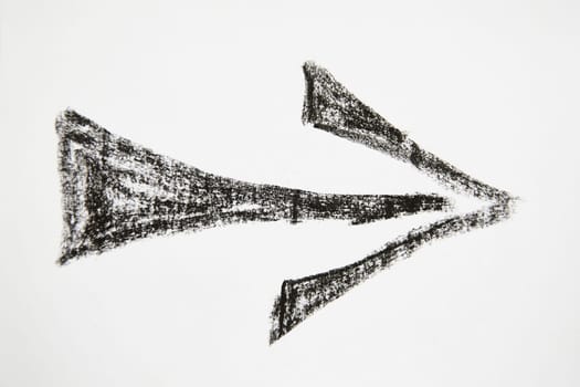 Thick graceful smooth Hand drawn black chalk arrow. Concept of business, choosing direction, moving forward. Abstract sign, background, texture. Blurred