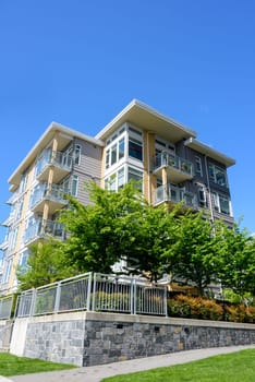 New residential building on land terrace with retaining wall