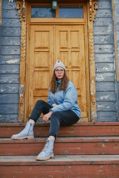 Portrait of a stylish woman in blue jacket. Spring outdoor portrait.