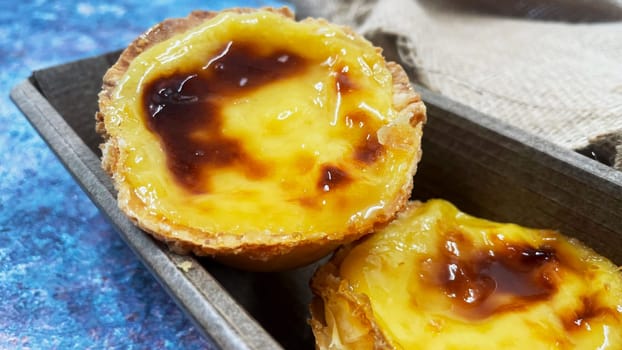 Lots of freshly baked desserts Pastel de nata or Portuguese egg tart. Pastel de Belm is a small pie with a crispy puff pastry crust and a custard cream filling. A small dessert, a cupcake