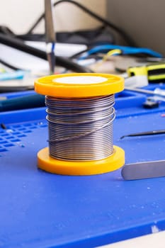 Solder coil on silicone soldering mat close up