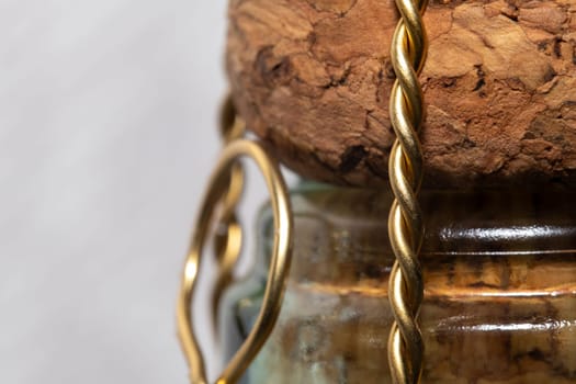 Extreme close up of a champagne bottle with its cork, copy space