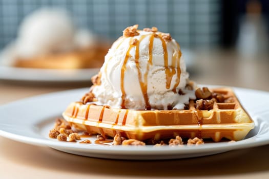 Ice cream topped waffle drizzled with caramel sauce and nuts