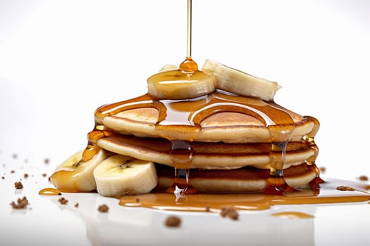Stack of pancakes with maple syrup and banana slices.
